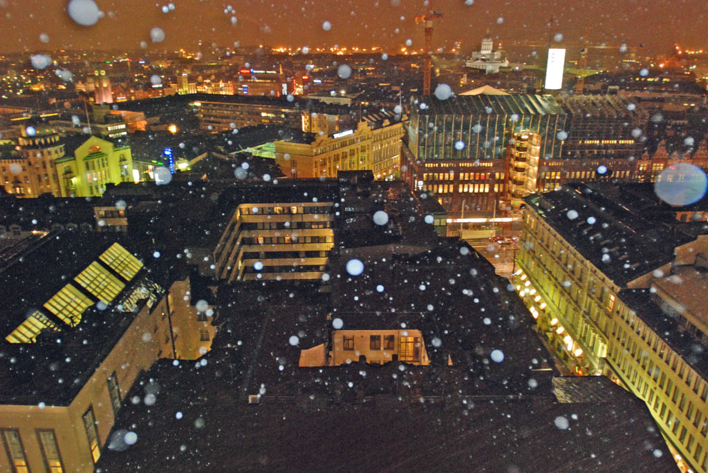 Helsinki: snow falling on asphalt, view from Torni