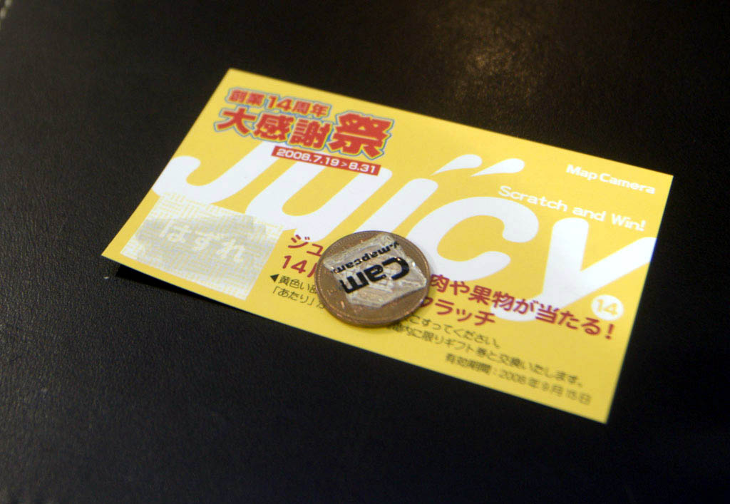 Tokyo: scratch card and coin with sticker