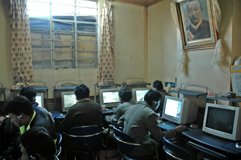 Lhasa: internet cafe, under the watchful eye